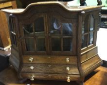 A miniature oak Dutch style cabinet