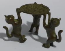 A small Chinese bronze cat form dish