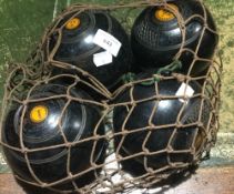 A set of four bowling woods