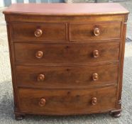 A Victorian mahogany bow front chest two over three graduated drawers with turned feet