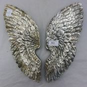 A pair of silver coloured angel wings