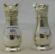 A pair of silver plated dog and cat cruets