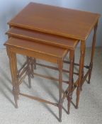 An Edwardian mahogany nest of three tables The moulded crossbanded rectangular tops supported on