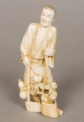 A 19th century Japanese carved ivory okimono Worked as a woodsman carrying an axe and a basket of