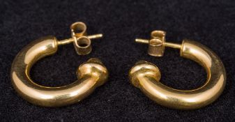 A pair of 18 ct gold three quarter hoop earrings 2 cm diameter.