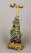 A Chinese carved green quartz mounted lamp Of florally carved lidded urn form. 53.5 cm high.