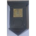 A 19th century ebonised wall clock The case of architectural form with stepped cornice above a band