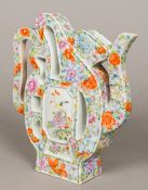 A 19th century Chinese porcelain millefleurs decorated wine pot Of calligraphic form,