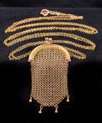 An unmarked gold mesh sovereign purse on a 9 ct gold chain The chain 146 cm long.