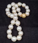 A South Seas pearl necklace With 14 ct gold diamond chip set clasp. 42 cm long.