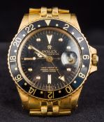 An 18 ct gold Rolex Oyster Perpetual gentleman's wristwatch The black dial with batons and buttons