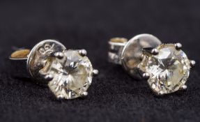 A pair of 18 ct white gold diamond set ear studs Each stone spreading to approximately 0.5 carat.