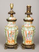 A pair of 19th century Canton porcelain lamps Of lidded vase form,