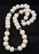 A pearl bead necklace Interspersed with diamond set spacers. 46 cm long.