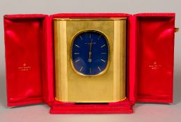 A Patek Philippe Ellipse D'Or Solar clock The blue dial with batons, in the gilt brushed brass case,