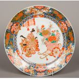 A 19th century Japanese porcelain charger Decorated in the Imari palette,