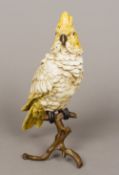 A cold painted bronze figure of a cockatoo Naturalistically modelled, perched,