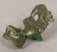 A Roman bronze casket foot Worked as a lion's paw with crouching beast terminal. 7 cm high.
