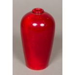 A Bernard Moore vase With allover red glaze, signed to base. 13.5 cm high.