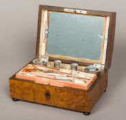 A 19th century French burr walnut sewing box The shaped hinged rectangular lid inset with a