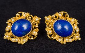 A pair of 14K gold lapis lazuli and seed pearl earrings Each of pierced screw clip form centred