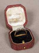 A diamond set gold five stone ring, probably 18 ct The central stone approximately 0.25 carat.