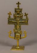 An antique brass Coptic cross The base inscribed with various text. 13 cm high.