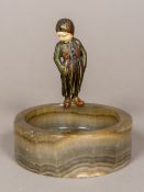 An Art Deco ivory mounted cold painted bronze figure Modelled as a child with ivory face smoking a