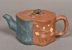 A Chinese Yixing pottery teapot Naturalistically modelled with polychrome decoration,