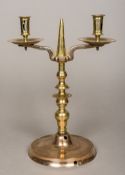A 17th century bronze twin branch candelabrum With knopped stem and spreading plinth foot. 34.