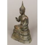 An Eastern cast bronze Buddha Typically worked seated. 24.5 cm high.