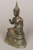 An Eastern cast bronze Buddha Typically worked seated. 24.5 cm high.