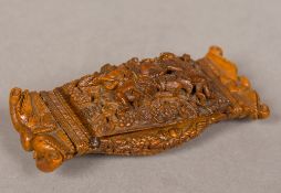 A 19th century carved coquilla nut snuff box The hinged lid carved with two figures,