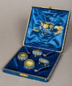 A set of four Russian enamel decorated silver gilt salts, each indistinctly marked to base,