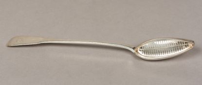 A George III silver table straining spoon, hallmarked London 1806,