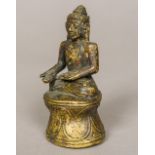 A Sino-Tibetan bronze figure of seated Buddha Typically worked. 9 cm high.