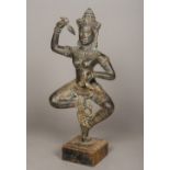 A Khmer bronze figure of the Goddess Uma Typically modelled in dancing pose holding a pair of lotus