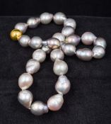 A Chinese fresh water baroque pearl necklace With silver lustre and magnetic gilt metal clasp. 46.