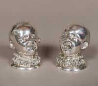 A pair of Victorian silver peppers, hallmarked London 1882,