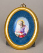 A 19th century Russian hand painted enamel on copper miniature of a Saint Inscribed with cyrillic