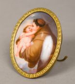 A 19th century painted porcelain plaque Of small proportions, decorated with a monk holding a putto,