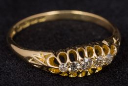 An 18 ct gold diamond set five stone ring Size Q/R.