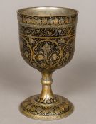 A gilt and niello decorated white metal chalice,
