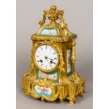 A 19th century porcelain inset gilt bronze mantel clock Set with Sevres style painted porcelain