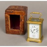 A French miniature brass cased carriage alarm clock Of typical form,