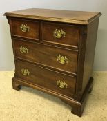 A 19th century mahogany chest of drawers of small proportions The moulded rectangular top above an