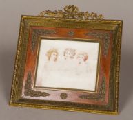 A 19th century French miniature portrait group on ivory Depicting three young women, one blonde,
