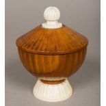 A 19th century ivory mounted carved wooden cup and cover Of domed fluted form with ivory knop
