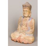 A Chinese carved wood and polychrome decorated seated Buddha, in the Tang style 33 cm high.