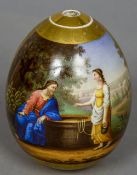 A finely painted 19th century Russian porcelain egg Decorated to one side with classical figures